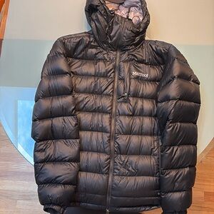 Extremely warm aand waterproof jacket. Has. Velcro sleeves and it’s 800 fill